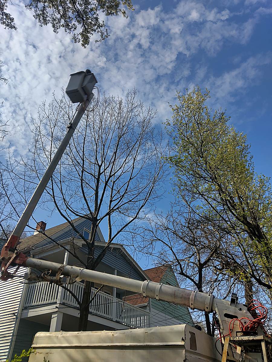 Bucket lift boom extended against a clear sky